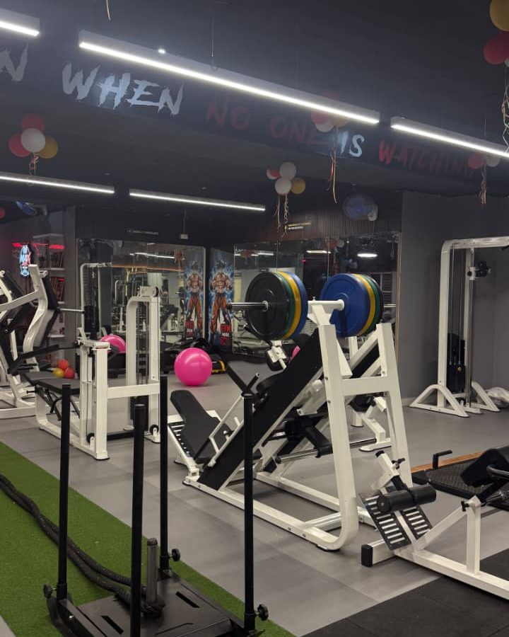 Sled on the turf lane, with the leg press behind