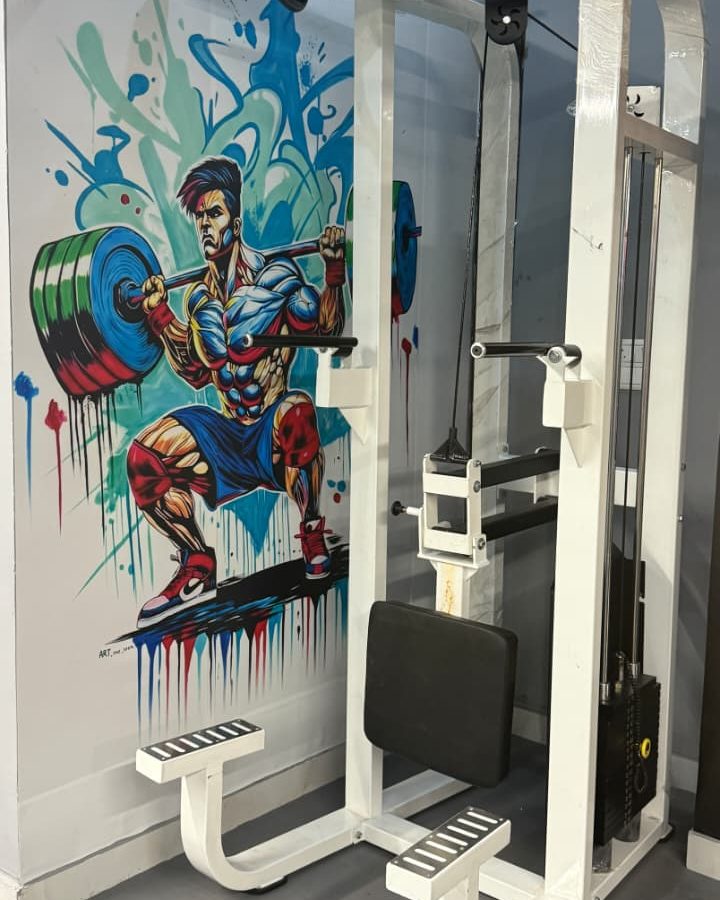 Lat pulldown station by the mural